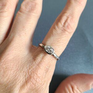 Sterling solver ring with clear cubic zirconia stone.